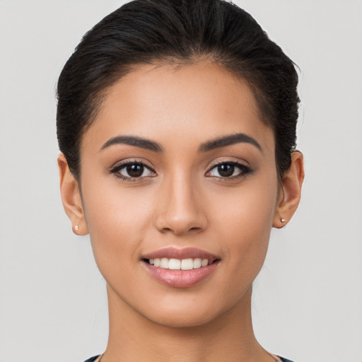 Joyful white young-adult female with short  brown hair and brown eyes