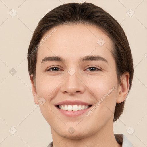 Joyful white young-adult female with short  brown hair and brown eyes