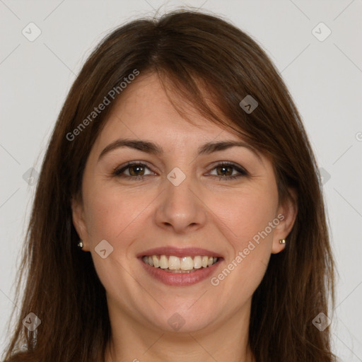 Joyful white young-adult female with long  brown hair and brown eyes