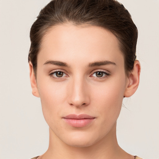 Neutral white young-adult female with short  brown hair and brown eyes