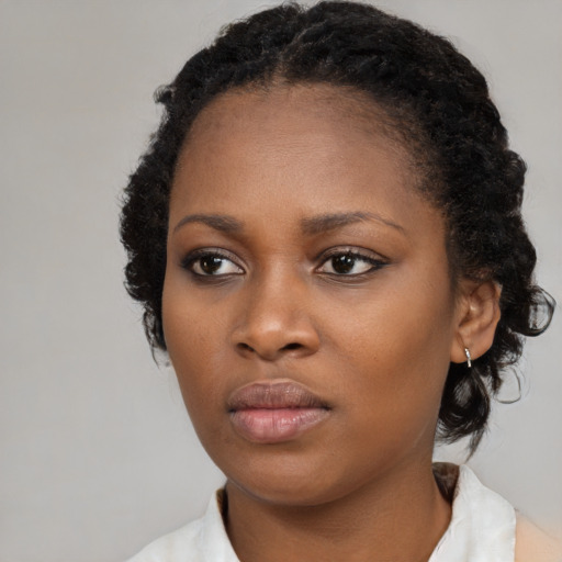 Neutral black young-adult female with medium  black hair and brown eyes