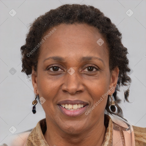 Joyful black adult female with short  brown hair and brown eyes