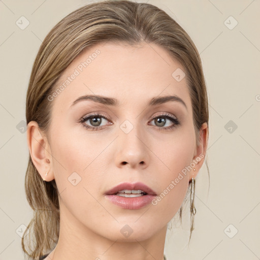 Joyful white young-adult female with medium  brown hair and green eyes