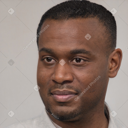 Joyful black young-adult male with short  black hair and brown eyes