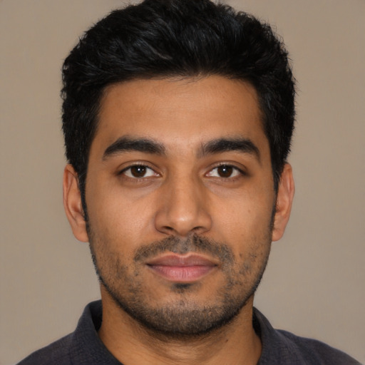 Neutral latino young-adult male with short  black hair and brown eyes