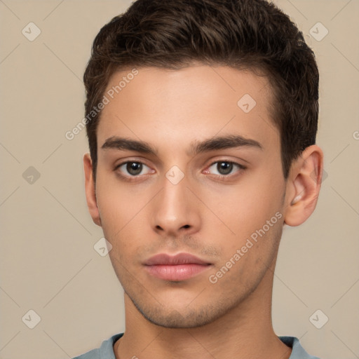 Neutral white young-adult male with short  brown hair and brown eyes