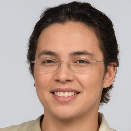 Joyful white adult female with medium  brown hair and brown eyes