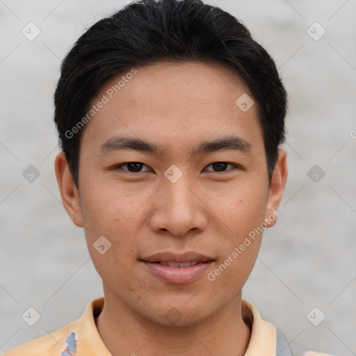 Joyful asian young-adult male with short  brown hair and brown eyes