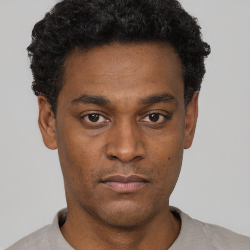 Neutral black young-adult male with short  black hair and brown eyes