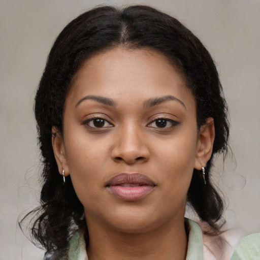 Joyful black young-adult female with medium  brown hair and brown eyes