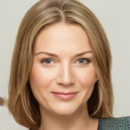 Joyful white young-adult female with medium  brown hair and green eyes