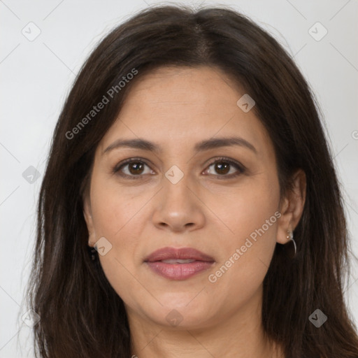 Joyful white adult female with long  brown hair and brown eyes