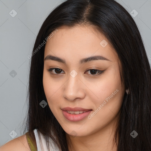 Joyful latino young-adult female with long  brown hair and brown eyes