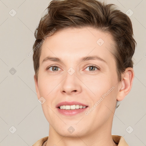 Joyful white young-adult female with short  brown hair and grey eyes