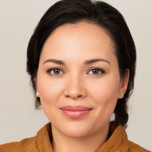 Joyful white young-adult female with medium  brown hair and brown eyes