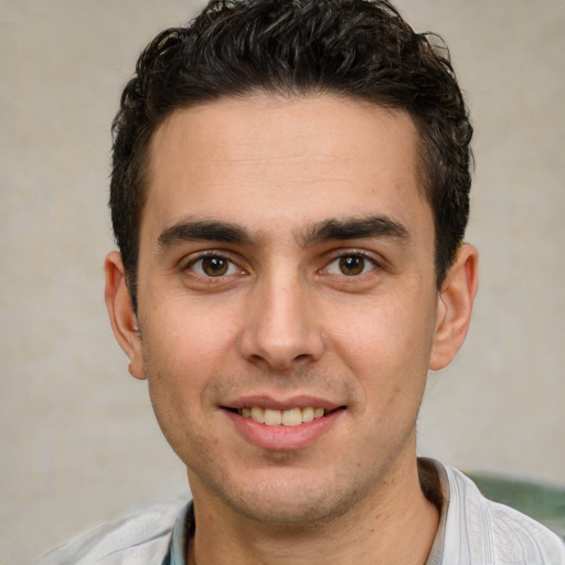 Joyful white young-adult male with short  brown hair and brown eyes