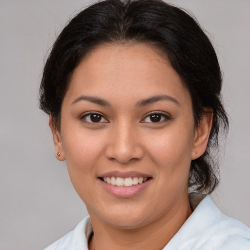Joyful white young-adult female with medium  brown hair and brown eyes