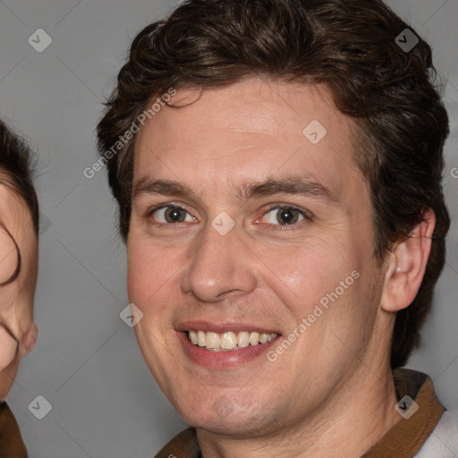 Joyful white adult male with medium  brown hair and brown eyes