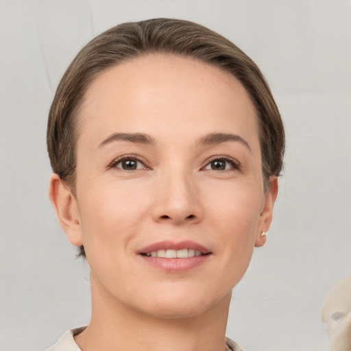 Joyful white young-adult female with short  brown hair and brown eyes