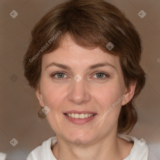 Joyful white adult female with medium  brown hair and grey eyes