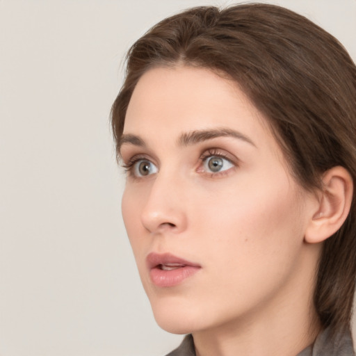 Neutral white young-adult female with medium  brown hair and grey eyes