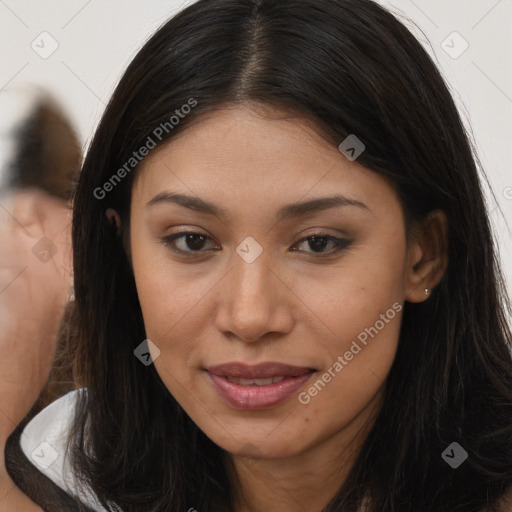 Joyful latino young-adult female with long  brown hair and brown eyes