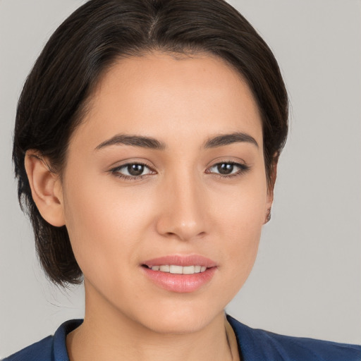 Joyful white young-adult female with medium  brown hair and brown eyes