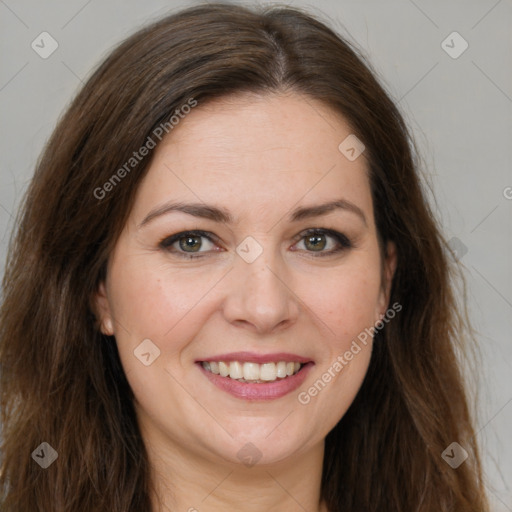 Joyful white adult female with long  brown hair and brown eyes