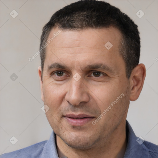 Joyful white adult male with short  brown hair and brown eyes