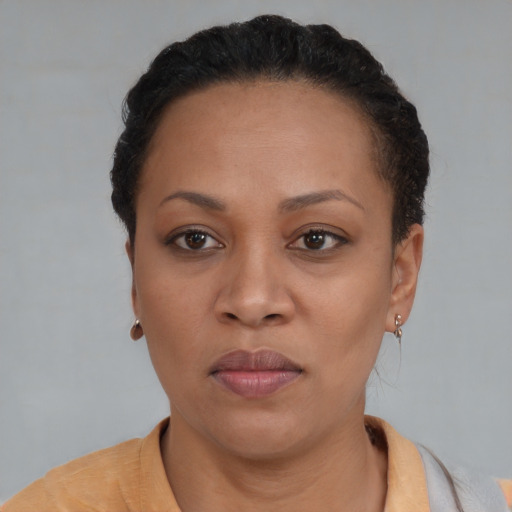 Neutral black adult female with short  black hair and brown eyes