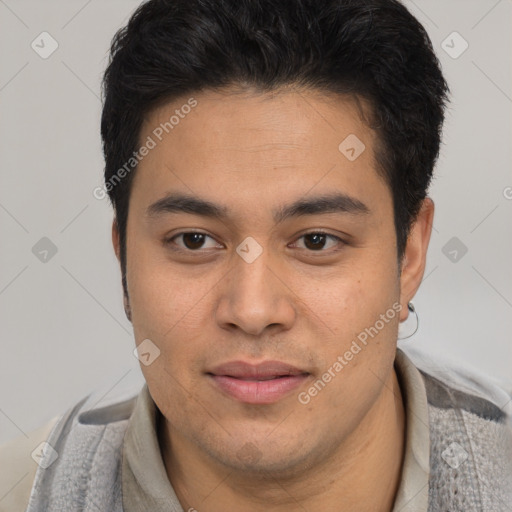 Joyful latino young-adult male with short  black hair and brown eyes