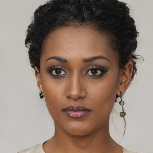 Neutral black young-adult female with short  brown hair and brown eyes