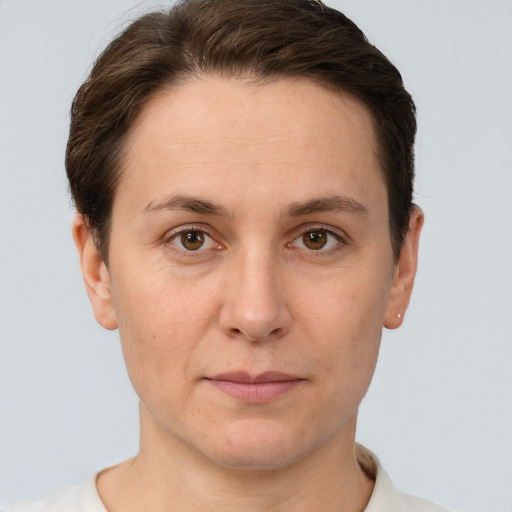 Joyful white adult female with short  brown hair and brown eyes