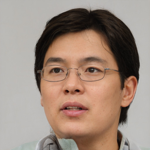 Neutral asian young-adult male with short  brown hair and brown eyes