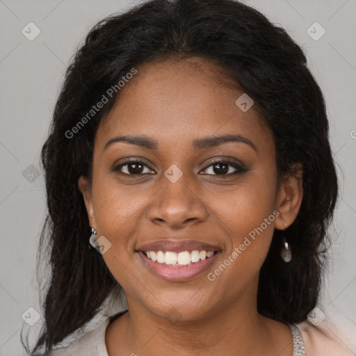 Joyful black young-adult female with medium  brown hair and brown eyes