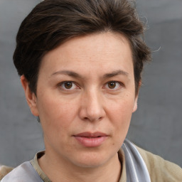 Joyful white adult female with short  brown hair and brown eyes