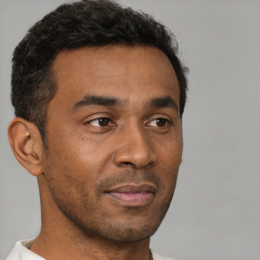 Neutral black young-adult male with short  brown hair and brown eyes