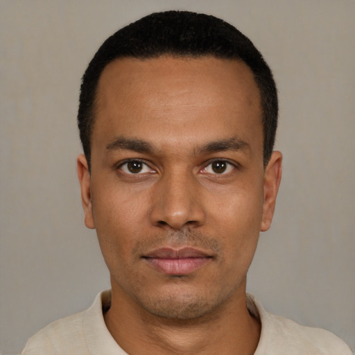 Neutral latino young-adult male with short  black hair and brown eyes