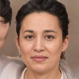 Joyful white adult female with short  brown hair and brown eyes