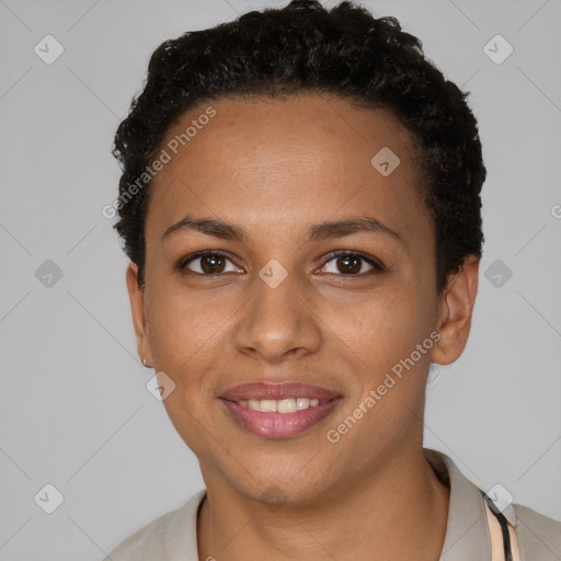 Joyful black young-adult female with short  brown hair and brown eyes