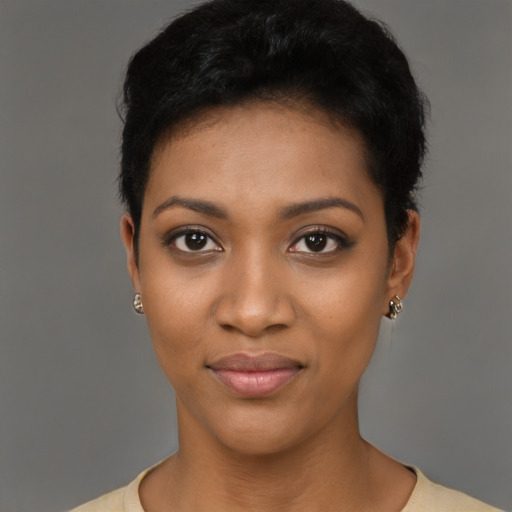 Joyful black young-adult female with short  black hair and brown eyes