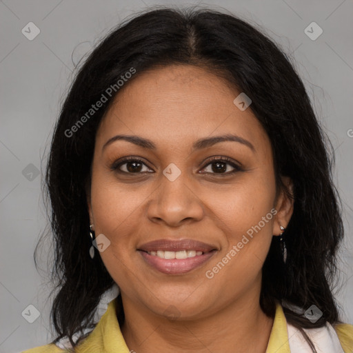 Joyful black adult female with medium  brown hair and brown eyes