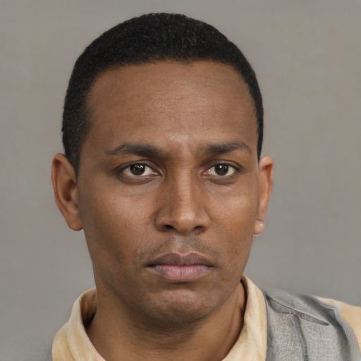 Neutral black young-adult male with short  brown hair and brown eyes