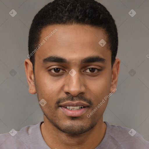 Joyful black young-adult male with short  black hair and brown eyes