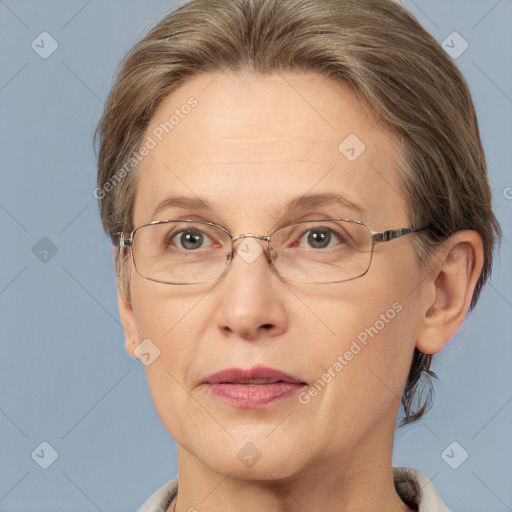 Joyful white adult female with medium  brown hair and blue eyes