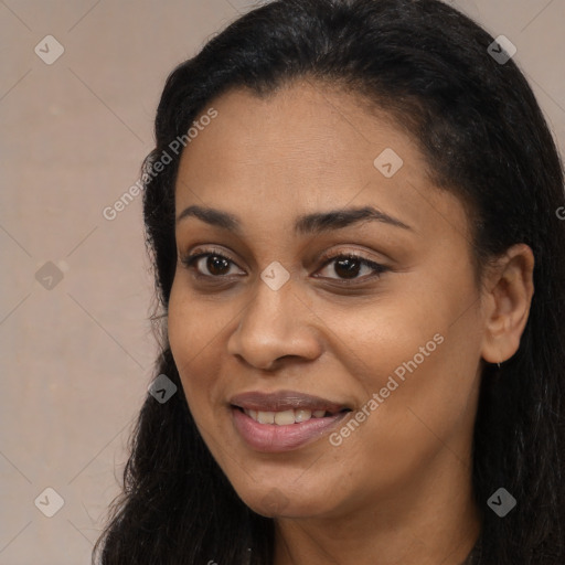 Joyful latino young-adult female with long  black hair and brown eyes