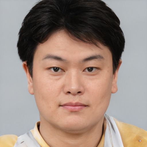 Neutral asian young-adult male with short  brown hair and brown eyes