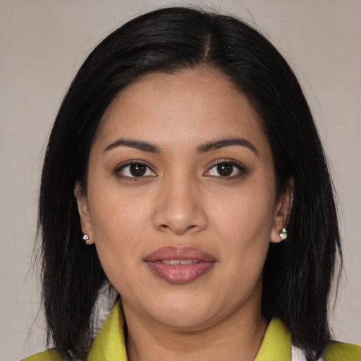 Joyful latino young-adult female with medium  black hair and brown eyes