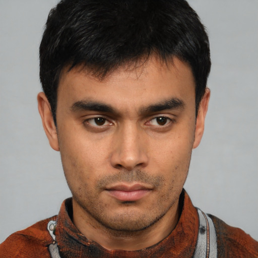Neutral latino young-adult male with short  brown hair and brown eyes
