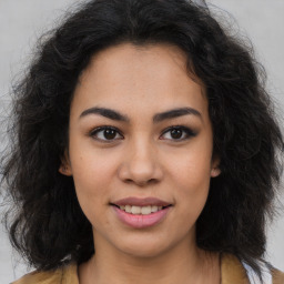 Joyful latino young-adult female with long  brown hair and brown eyes